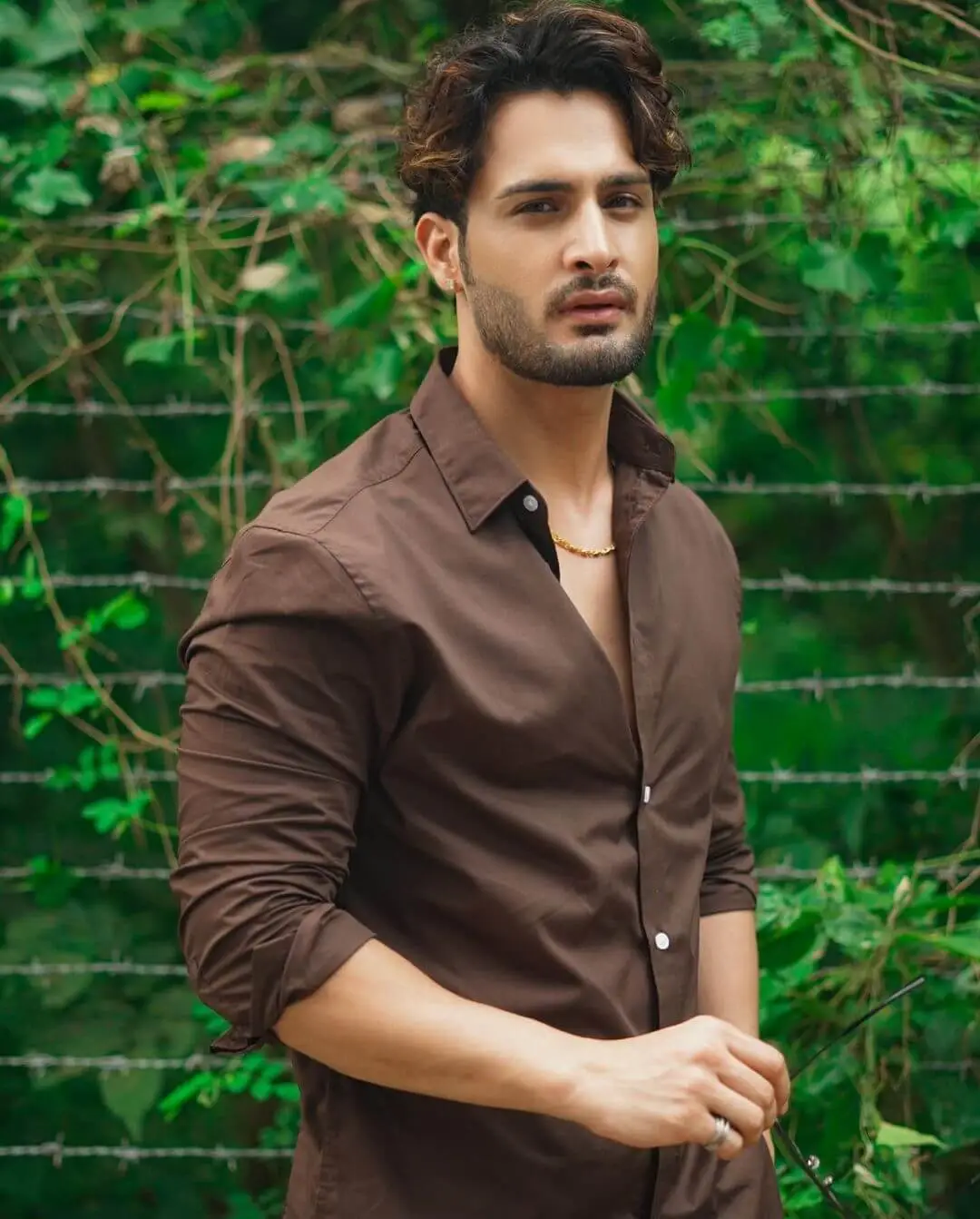 Umar in brown shirt