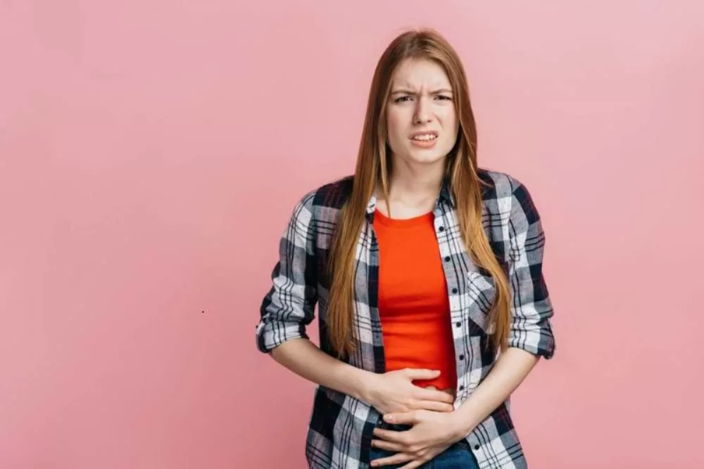 A girl having a pain in her stomach