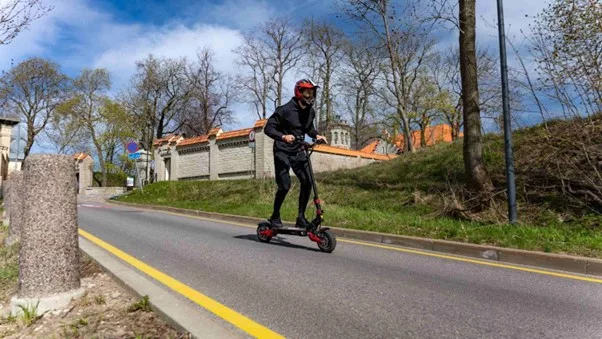 boy with scooter on streets