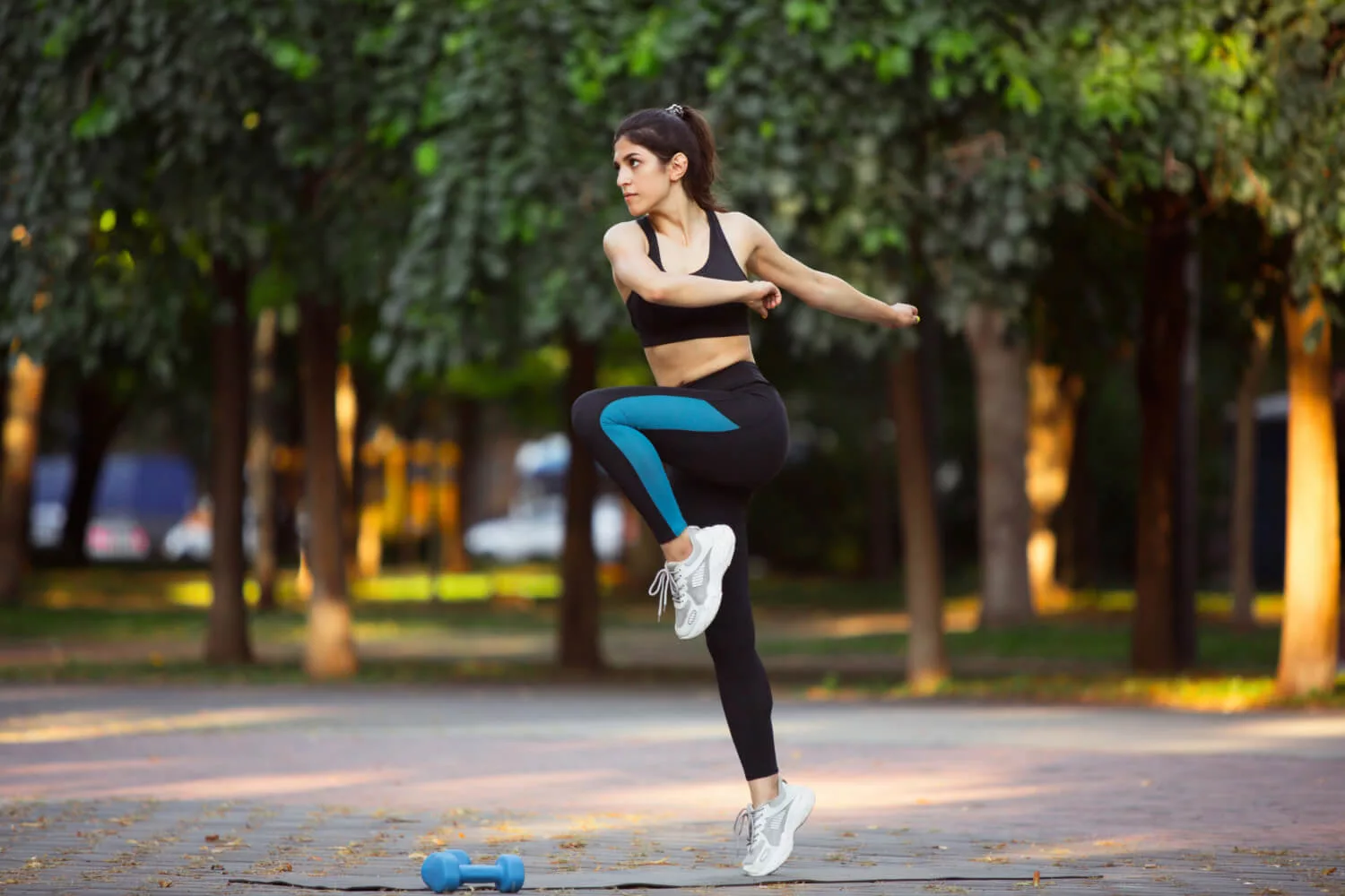 young-female-athlete-training-city-street-summer-sunshine-beautiful-woman-practicing-working-out-concept-sport-healthy-lifestyle-movement-activity-stretching