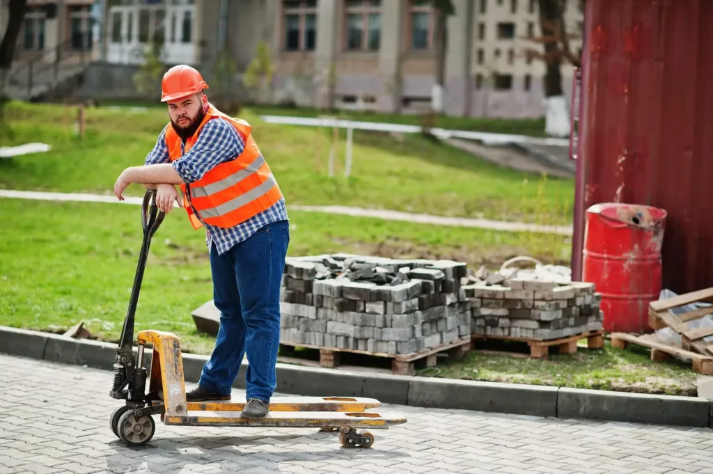 a worker working on the driveway