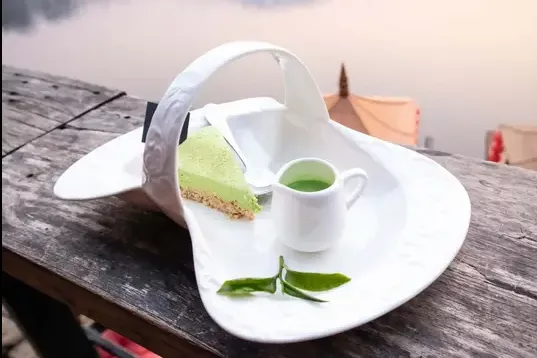 https://www.pexels.com/photo/photo-of-match-cake-and-matcha-drink-on-a-porcelain-plate-8128636/