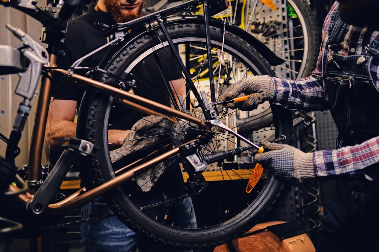 mechanic fixing bicycle