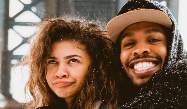 Zendaya posing with one of her brothers'