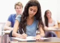 girl in blue giving exam
