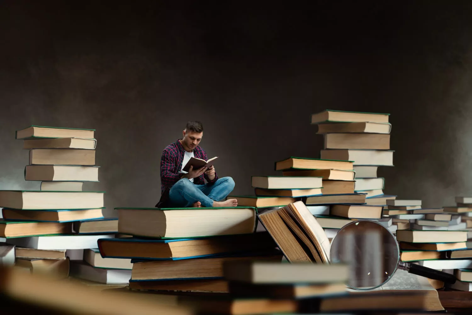 little man between books