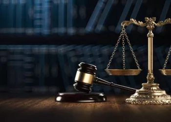 legal books and gavel along with the scales of Justice on the table
