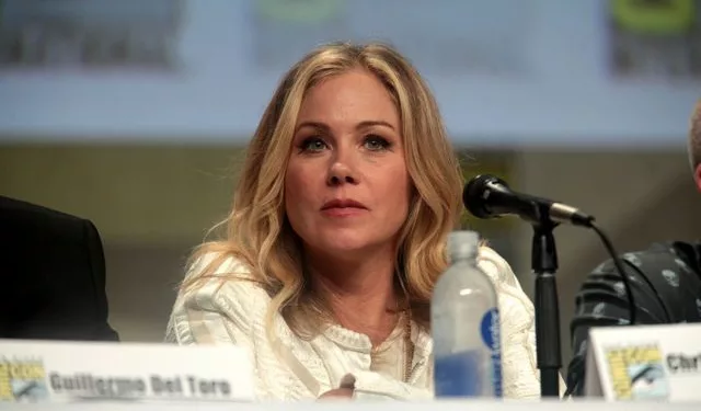 Christina Applegate speaking at the 2014 San Diego Comic Con International, for "The Book of Life", at the San Diego Convention Center in San Diego, California on July 25, 2014. She is wearing white colored clothes.