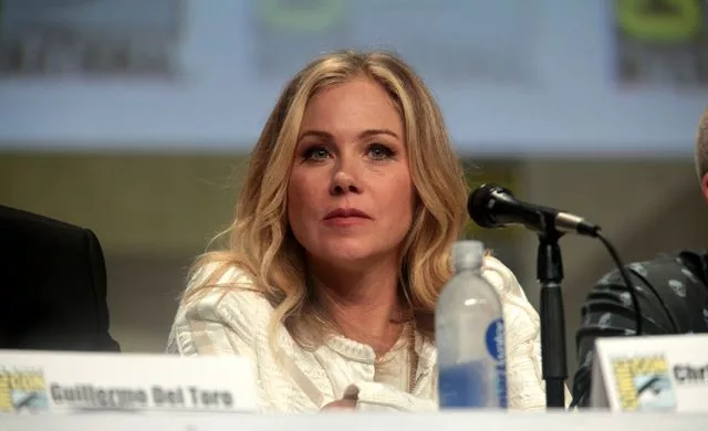 Christina Applegate speaking at the 2014 San Diego Comic Con International, for "The Book of Life", at the San Diego Convention Center in San Diego, California on July 25, 2014. She is wearing white colored clothes.