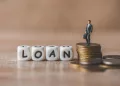 financial-loan-concept-businessmen-stand-money-coin-loan-money-loan-officer