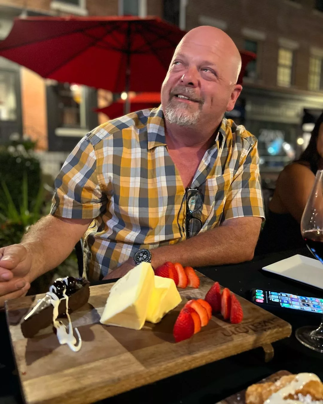 Rick Harrison sitting at a Bar Avlon, wearing yellow grey white check shirt.