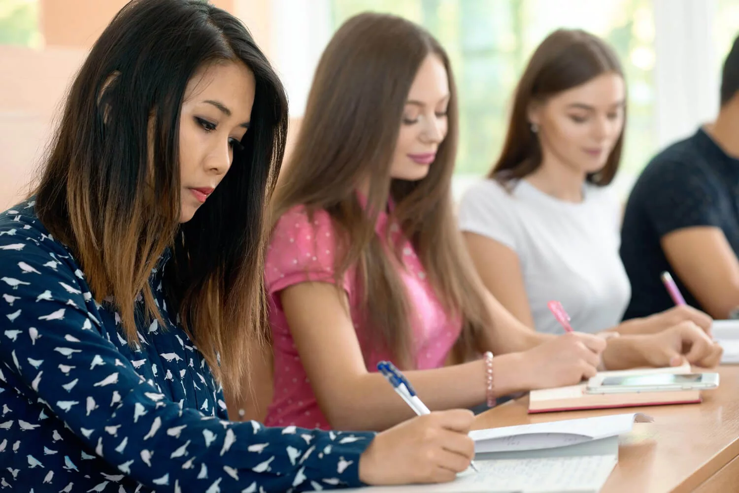 concentrated-girls-studying-university-prepearing-exams 