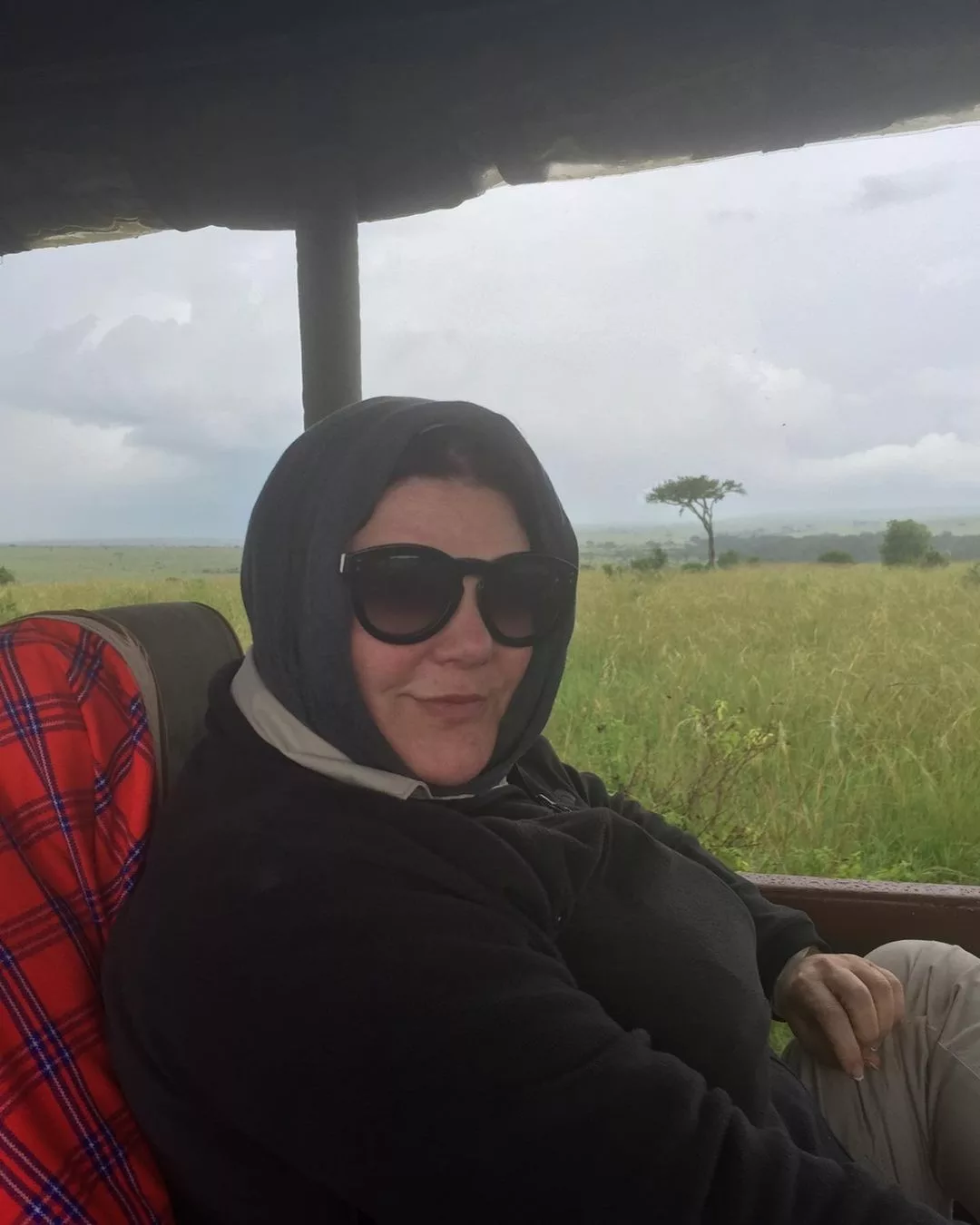 Ann wearing a woolen scarf and sunglasses.