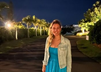 Eric weinberger's wife, Alexandra Kreisler, wearing a blue dress and jacket.